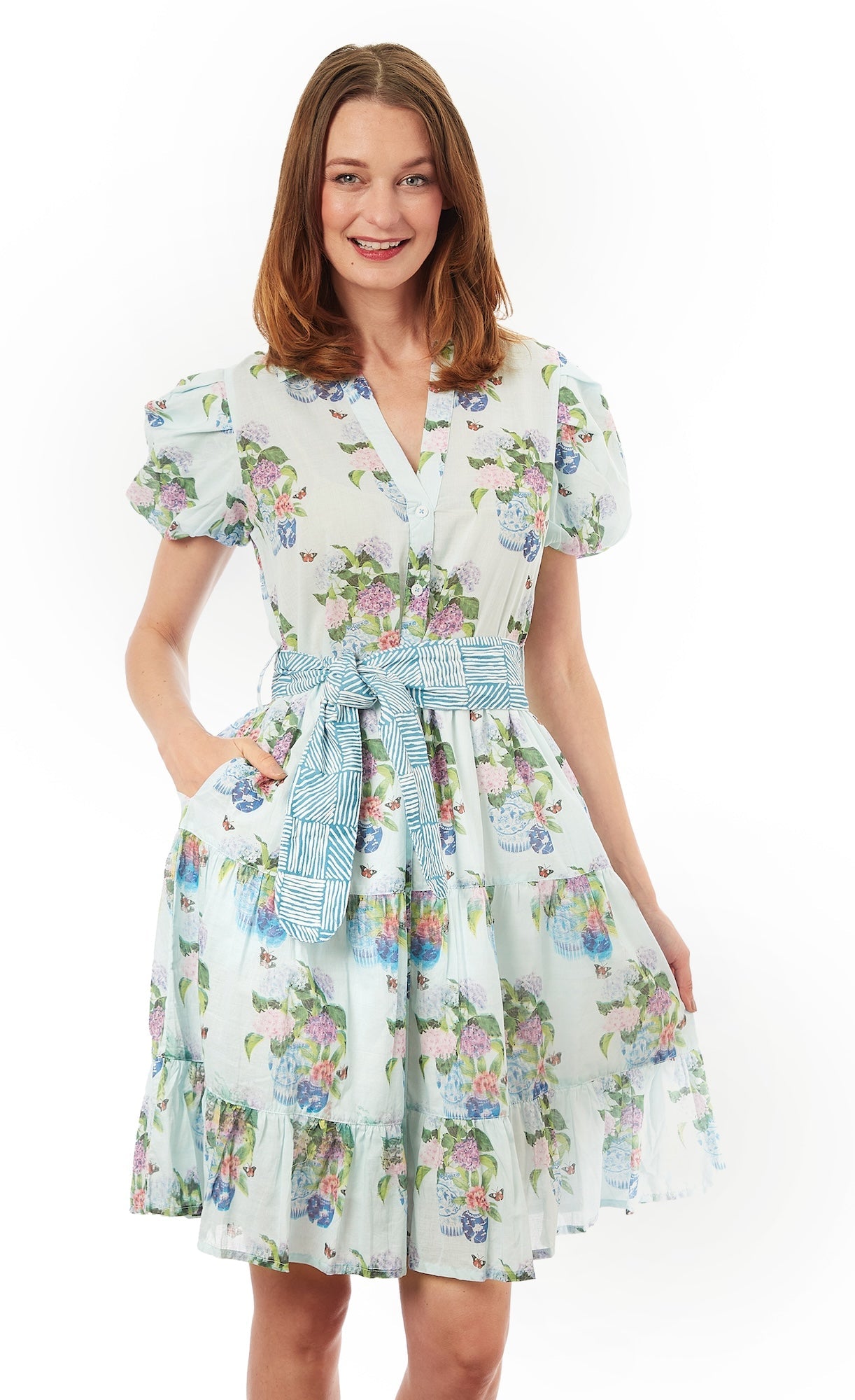 Dizzy-Lizzie Litchfield Short Blue Hydrangeas dress displayed on a mannequin, featuring a stylish floral design and short sleeves.