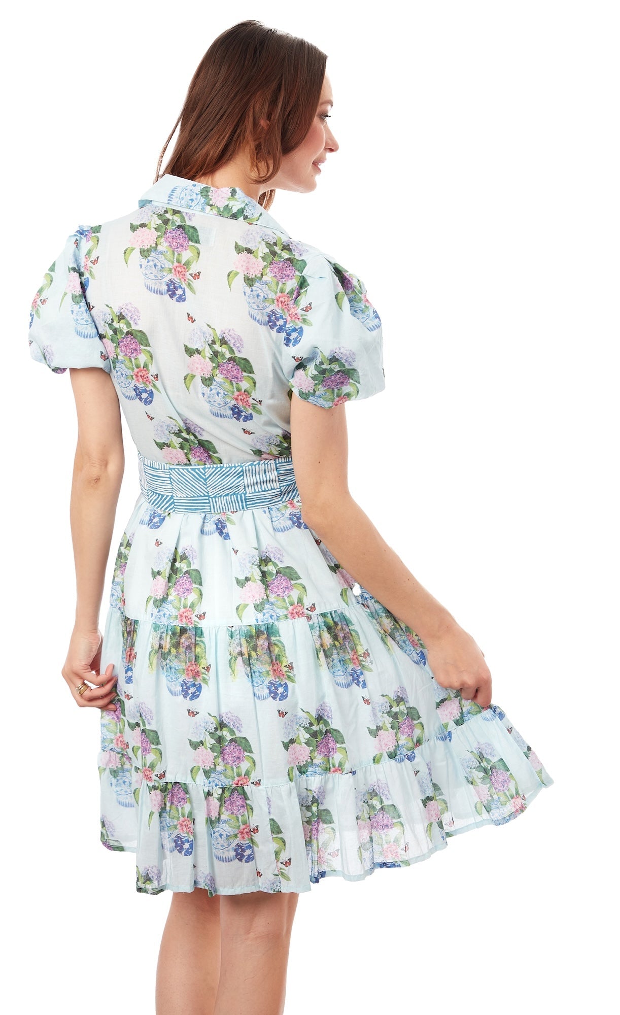 Dizzy-Lizzie Litchfield Short Blue Hydrangeas dress displayed on a hanger, featuring a floral pattern and short hemline.