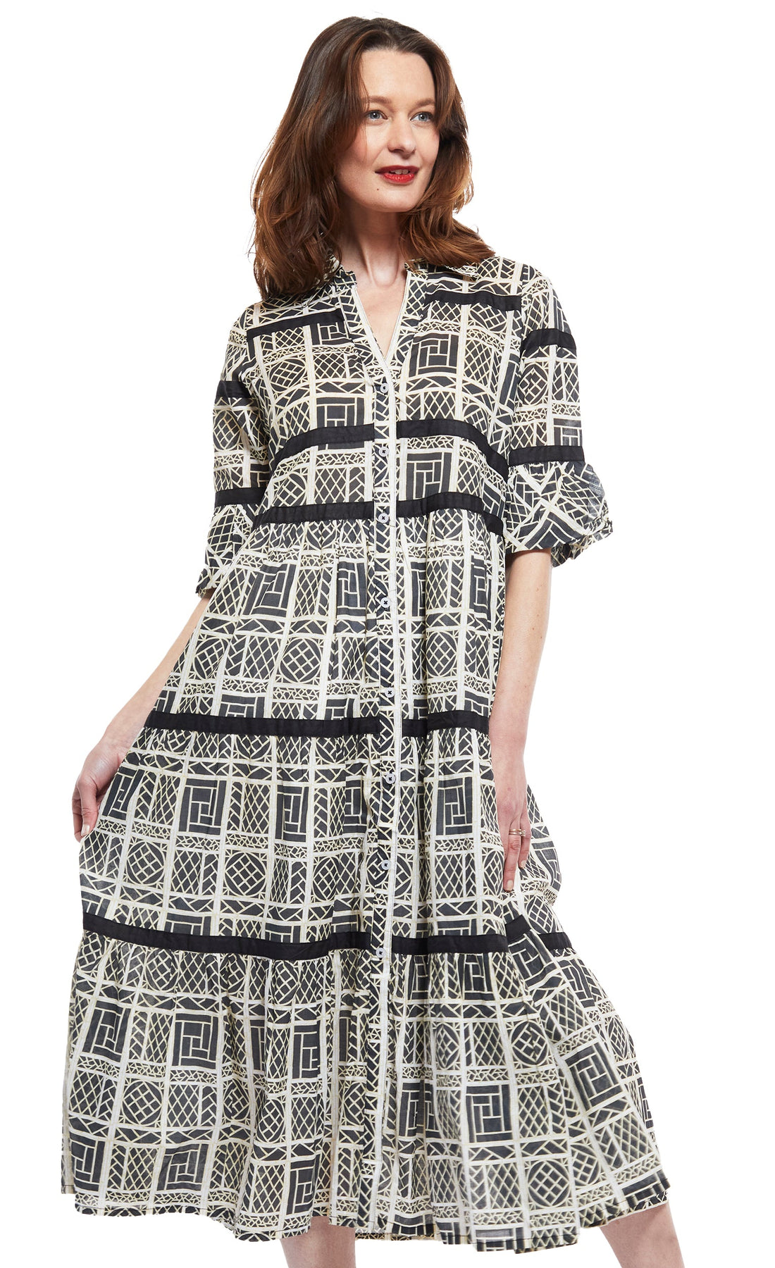Dizzy-Lizzie Miami Style midi dress with black ribbons, white wicker details, flounce design, and black and white color scheme.