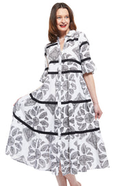 Dizzy-Lizzie Miami Style midi dress with flounce, black ribbons, and black and white paisley pattern on a model.