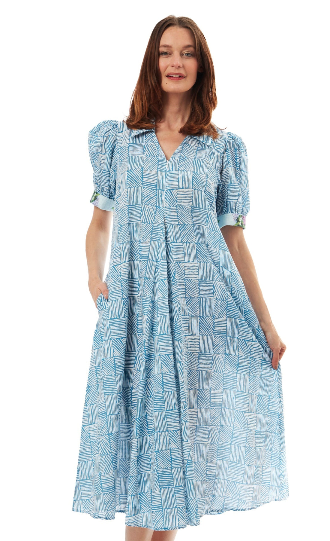Dizzy-Lizzie Montauk Dress in turquoise and white with criss-cross design, sleeveless style, lightweight fabric, perfect for summer wear.