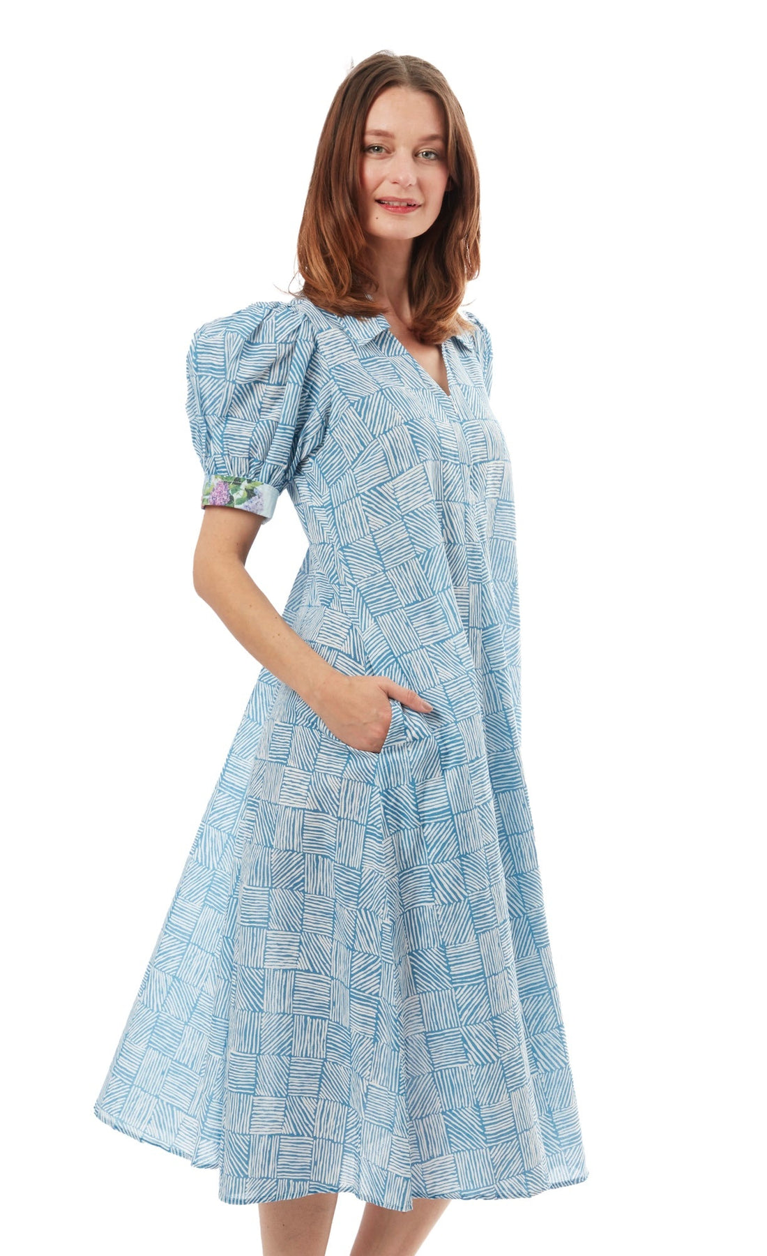 Dizzy-Lizzie Montauk Dress in turquoise and white with criss-cross design, lightweight fabric, sleeveless, perfect for summer.