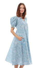 Dizzy-Lizzie Montauk Dress in turquoise and white with criss-cross design, lightweight fabric, sleeveless, perfect for summer.