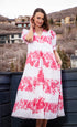 Pink floral print Montauk dress by Dizzy-Lizzie, featuring a flowy fabric and casual summer style.