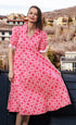 Pink and white geometric print Montauk dress by Dizzy-Lizzie, showcasing a stylish, flowing dress with a vibrant pattern.