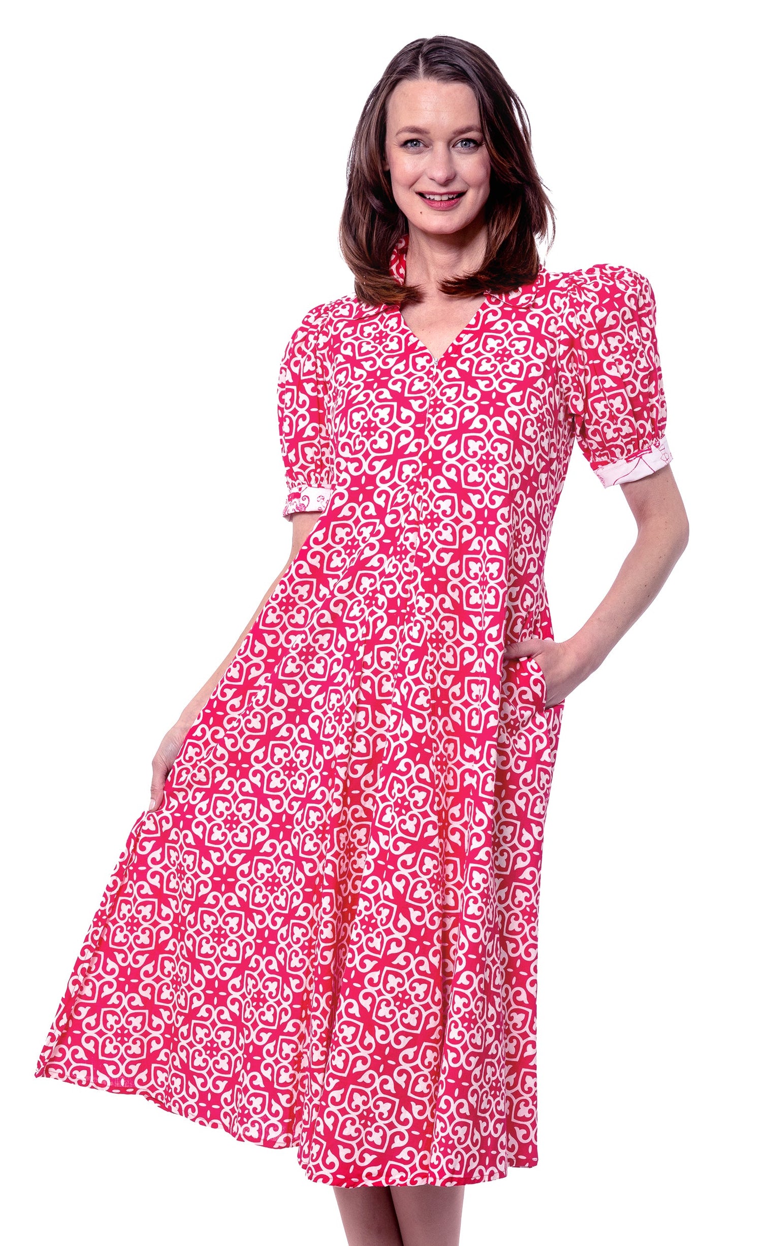 Dizzy-Lizzie Montauk pink and white geometric dress featuring a stylish, flowy design on a model.