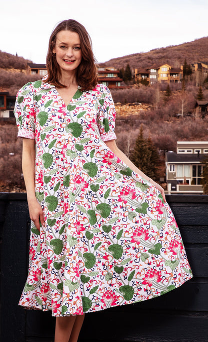 White floral Montauk Dress by Dizzy-Lizzie, featuring a flowing fabric and elegant design, perfect for summer occasions.