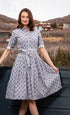 Dizzy-Lizzie Mrs Maisel black and white geometric dress with fitted silhouette and stylish pattern.