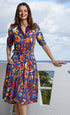 Mrs Maisel fruit print dress by Dizzy-Lizzie featuring vibrant colorful fruit patterns on a stylish, feminine dress.