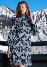 Black Sag Harbor dress by Dizzy-Lizzie featuring buckle accents, shown on a model with a fitted silhouette and stylish design.