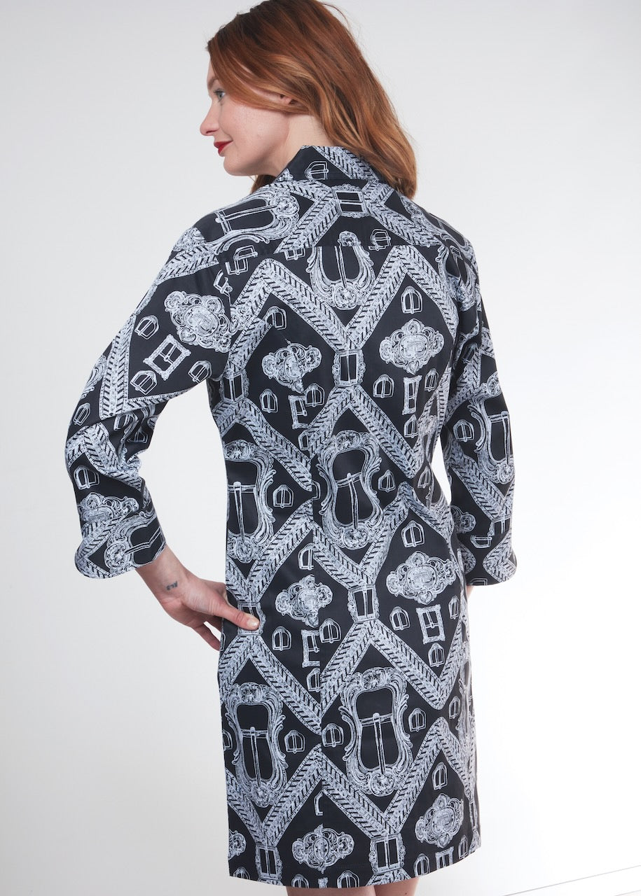 Black Sag Harbor dress by Dizzy-Lizzie featuring buckle accents, shown on a model with a fitted silhouette and stylish design.