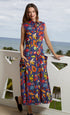 Sea Island Dress by Dizzy-Lizzie featuring a vibrant fruit print, sleeveless design, and flowy fabric for a stylish summer look.