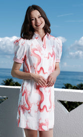 Left Bank puff sleeve cotton dress by Dizzy-Lizzie in coral with white dragon print, featuring a stylish and comfortable design.