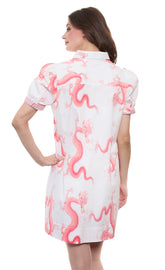 Left Bank puff sleeve cotton dress by Dizzy-Lizzie in coral with white dragon print, featuring a stylish, feminine design.