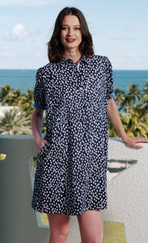 Navy and white polka dot puff sleeve dress by Dizzy-Lizzie, featuring a stylish and feminine design.