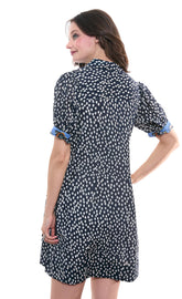 Navy and white polka dot puff sleeve dress by Dizzy-Lizzie, featuring a stylish, feminine design with ruffled details.