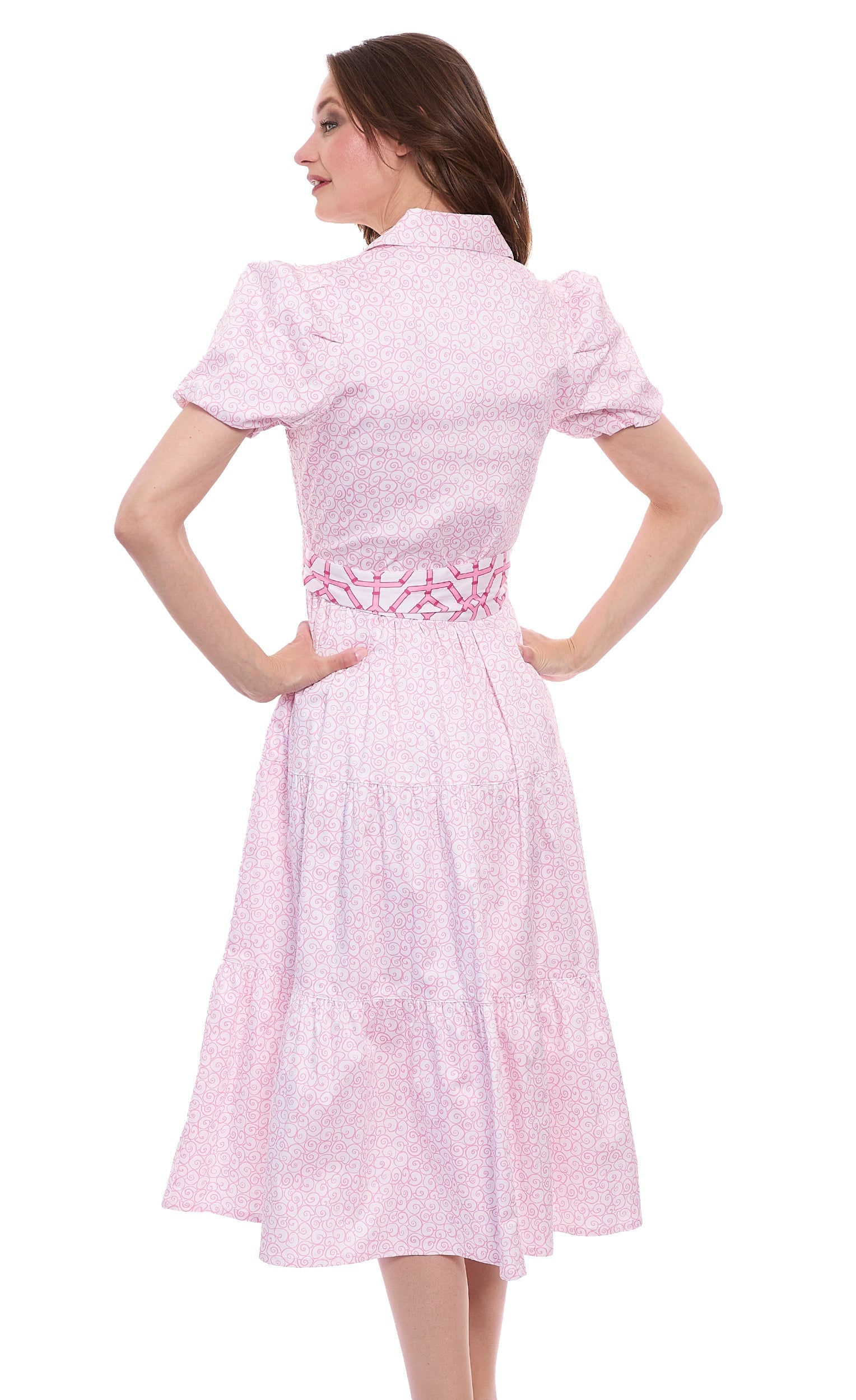 Dizzy-Lizzie Litchfield pink and white swirl print dress with sleeveless design and flowy fabric.