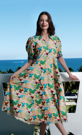 Dizzy-Lizzie Montauk Dress in linen and cotton with a neutral butterfly print, featuring a relaxed fit and feminine design.
