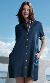 Dizzy-Lizzie Newport Dress in denim featuring gold buttons, sleeveless design, and a casual, stylish fit.