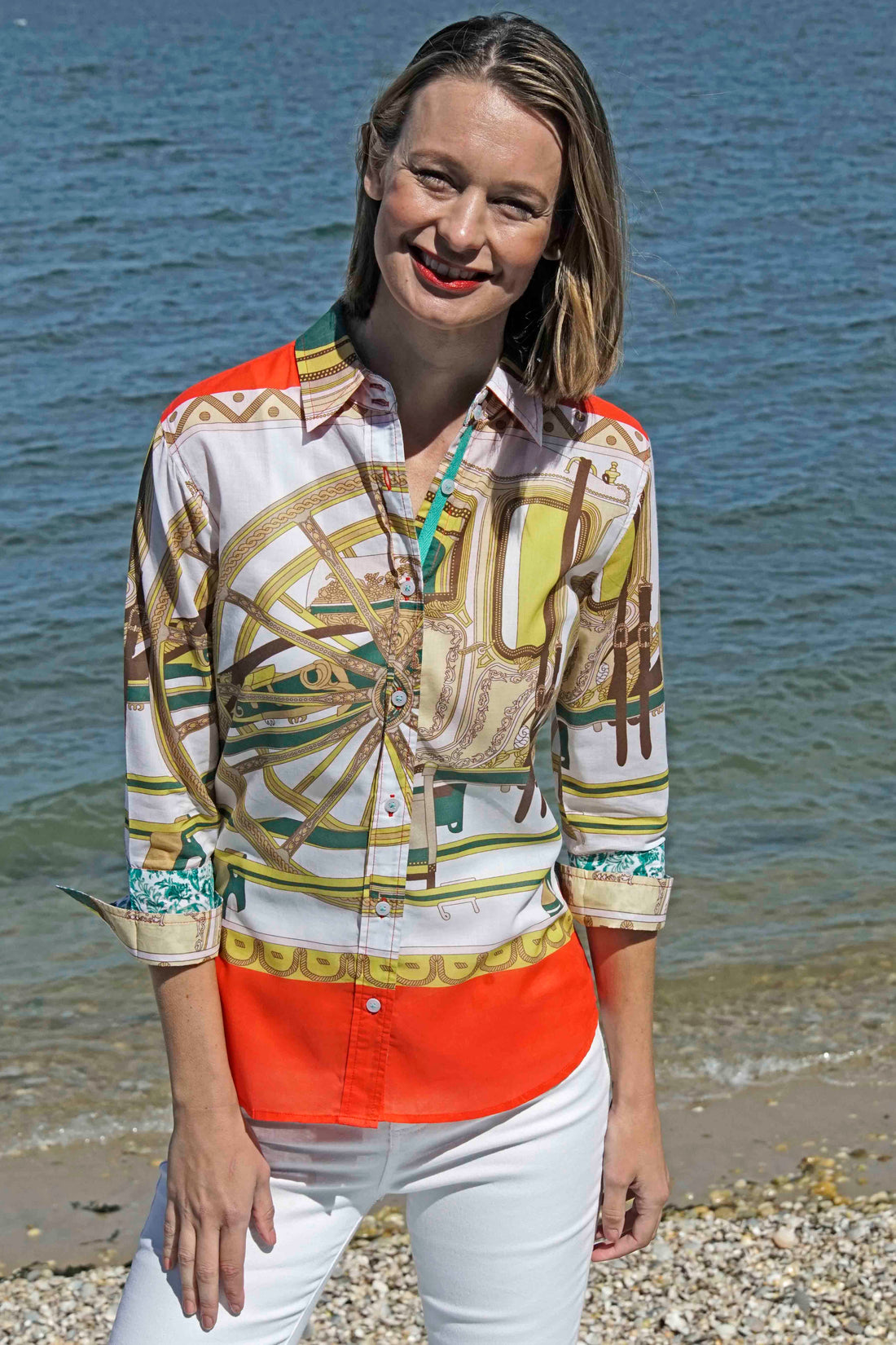 Dizzy-Lizzie 3/4 sleeve shirt with melon and chartreuse wagon wheel print, featuring a stylish, casual design.