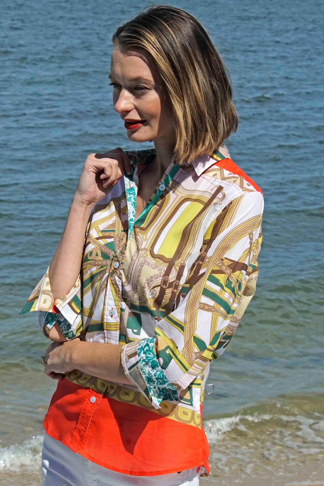 Dizzy-Lizzie 3/4 sleeve wagon wheel print shirt featuring a melon and chartreuse design with a relaxed fit.