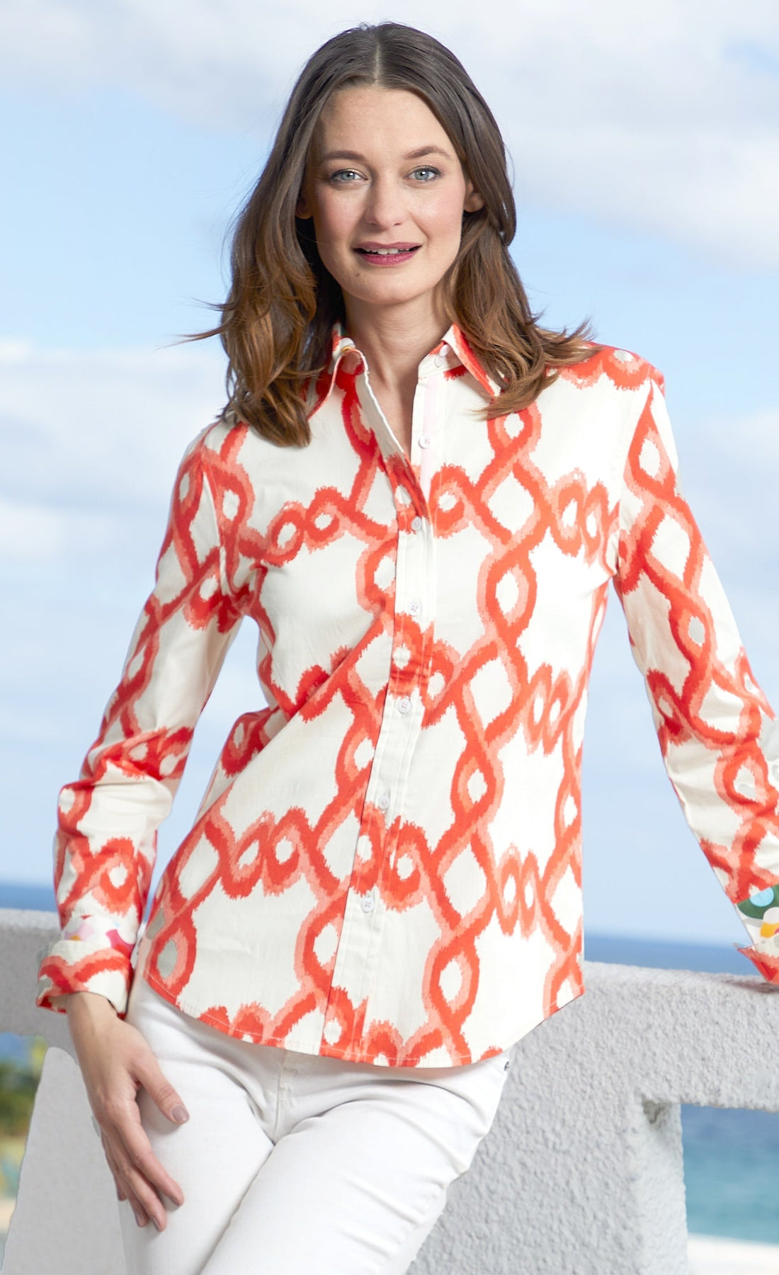 Orange and white flame stitch Dizzy-Lizzie Rome shirt displayed on a mannequin, showcasing stylish casual design.