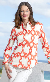 Orange and white flame stitch Dizzy-Lizzie Rome shirt displayed on a mannequin, showcasing stylish casual design.