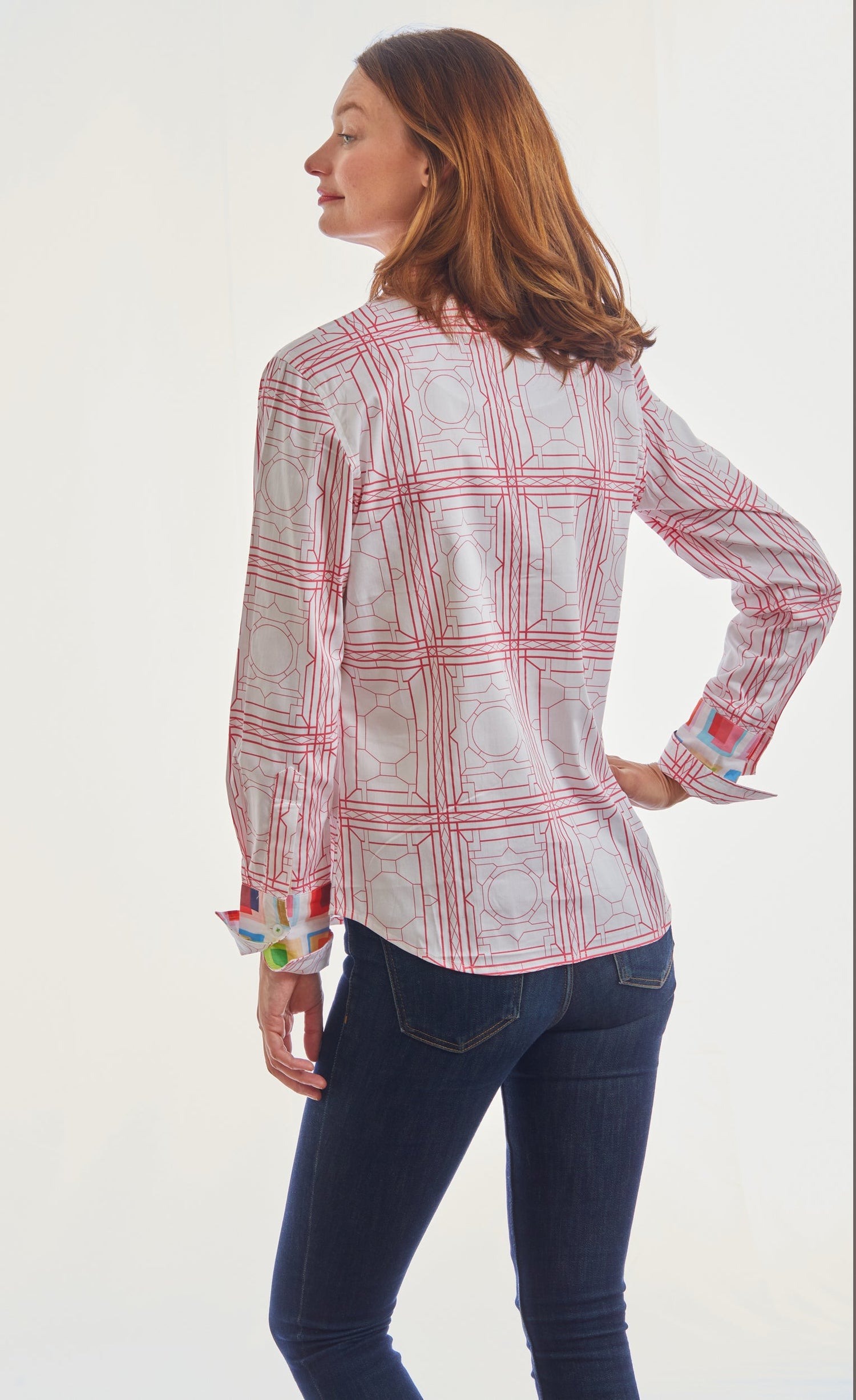 Pink and white geometric pattern Rome shirt by Dizzy-Lizzie shown on a hanger.
