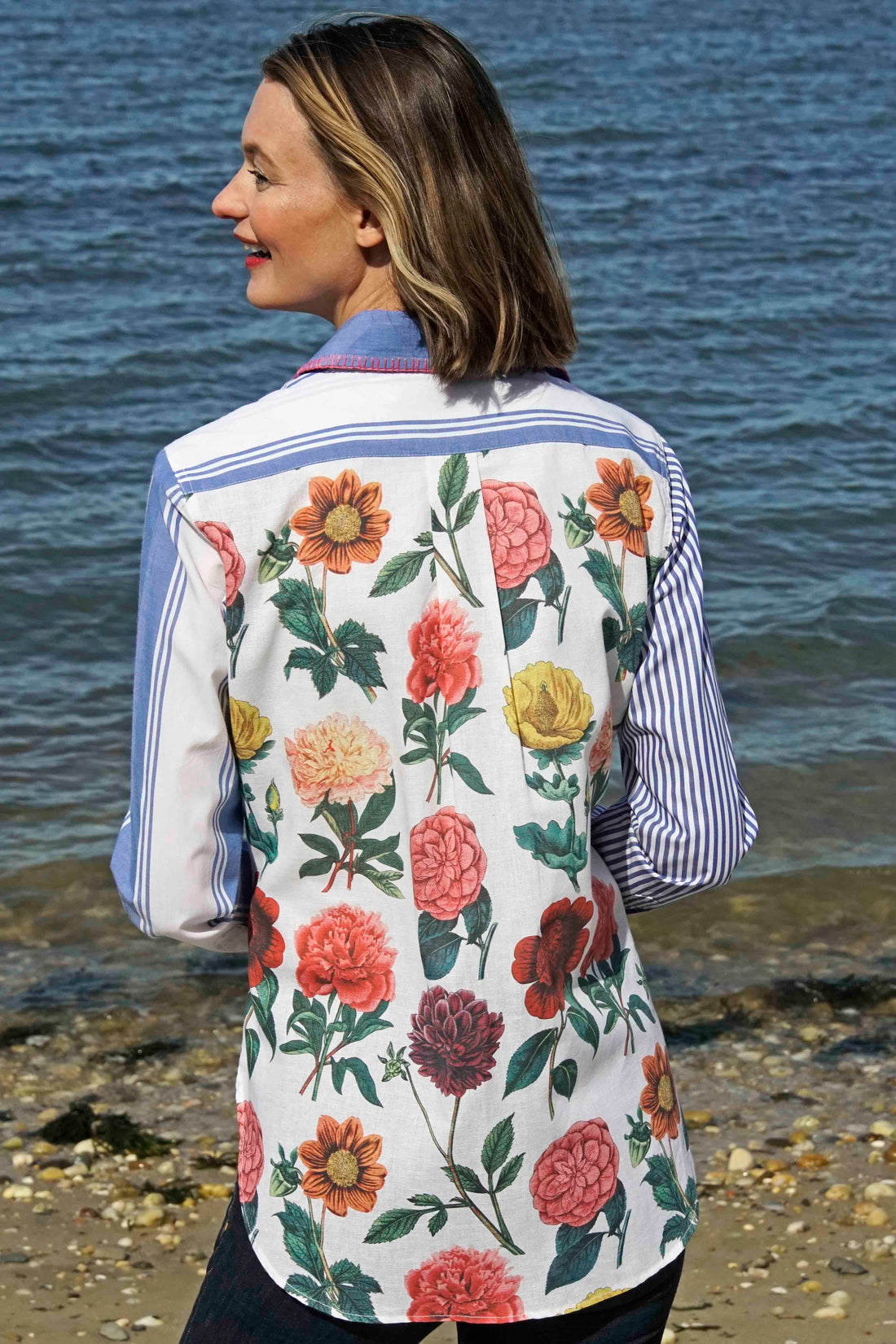 Dizzy-Lizzie Madison top shirt with colorful stripes and floral pattern, featuring whipstitch detail at collar.