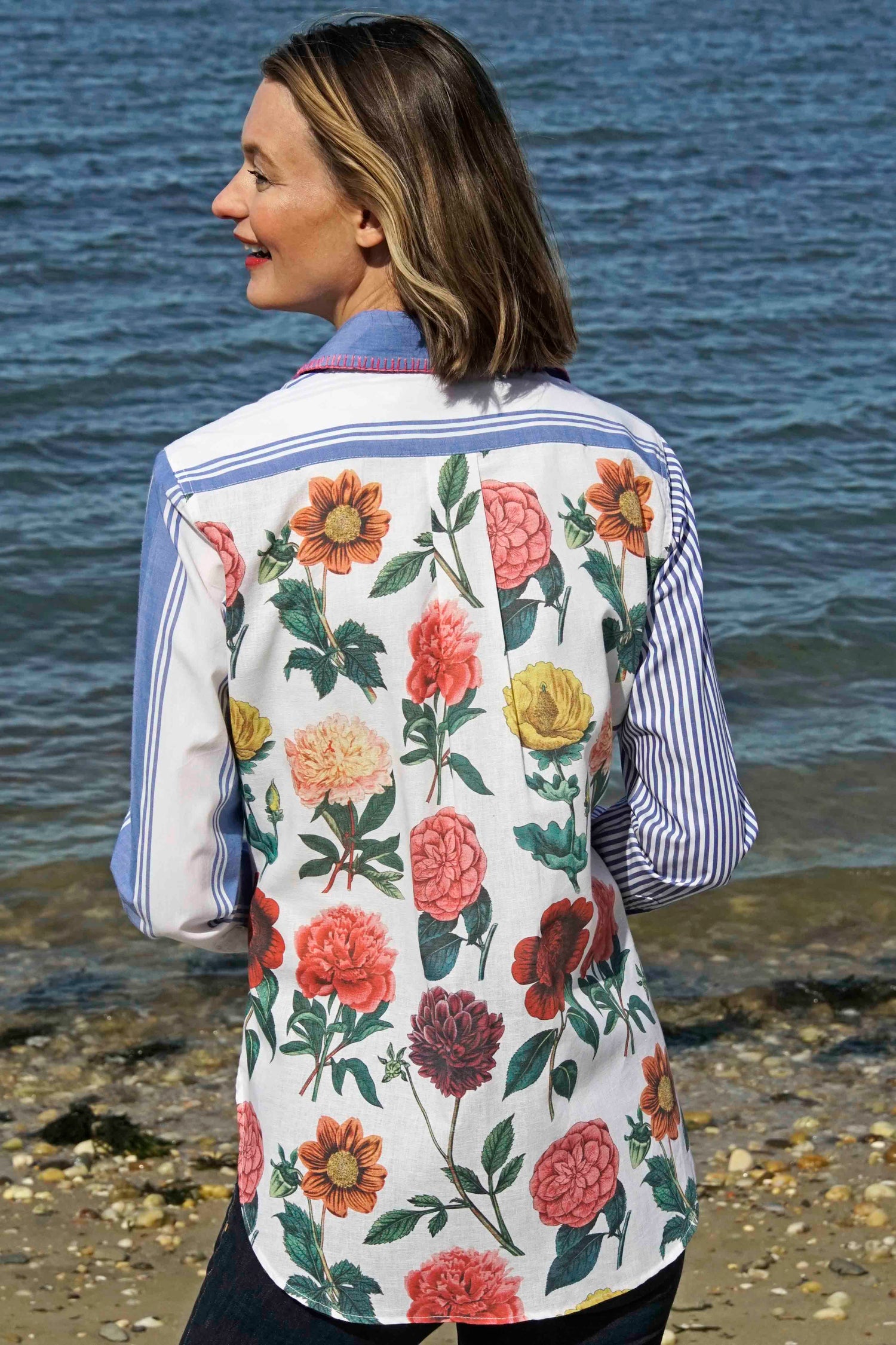 Dizzy-Lizzie Madison top shirt with colorful stripes and floral pattern, featuring whipstitch detail at collar.