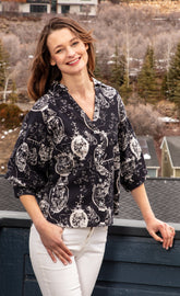Dizzy-Lizzie oversized black and white puff sleeve shirt with a relaxed fit and stylish design.