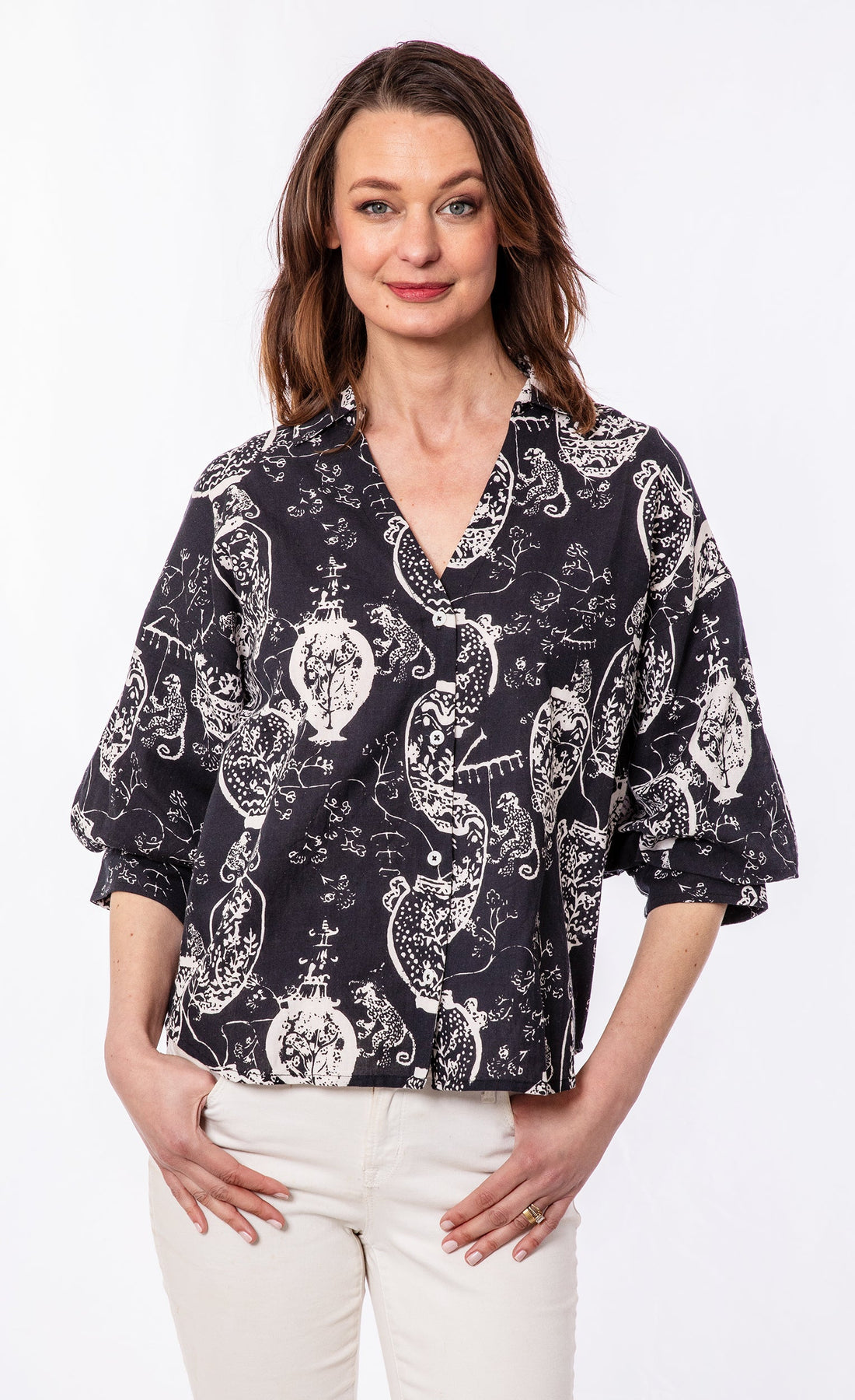 Black and white oversized puff sleeve shirt by Dizzy-Lizzie, featuring bold contrasting patterns and a relaxed fit.