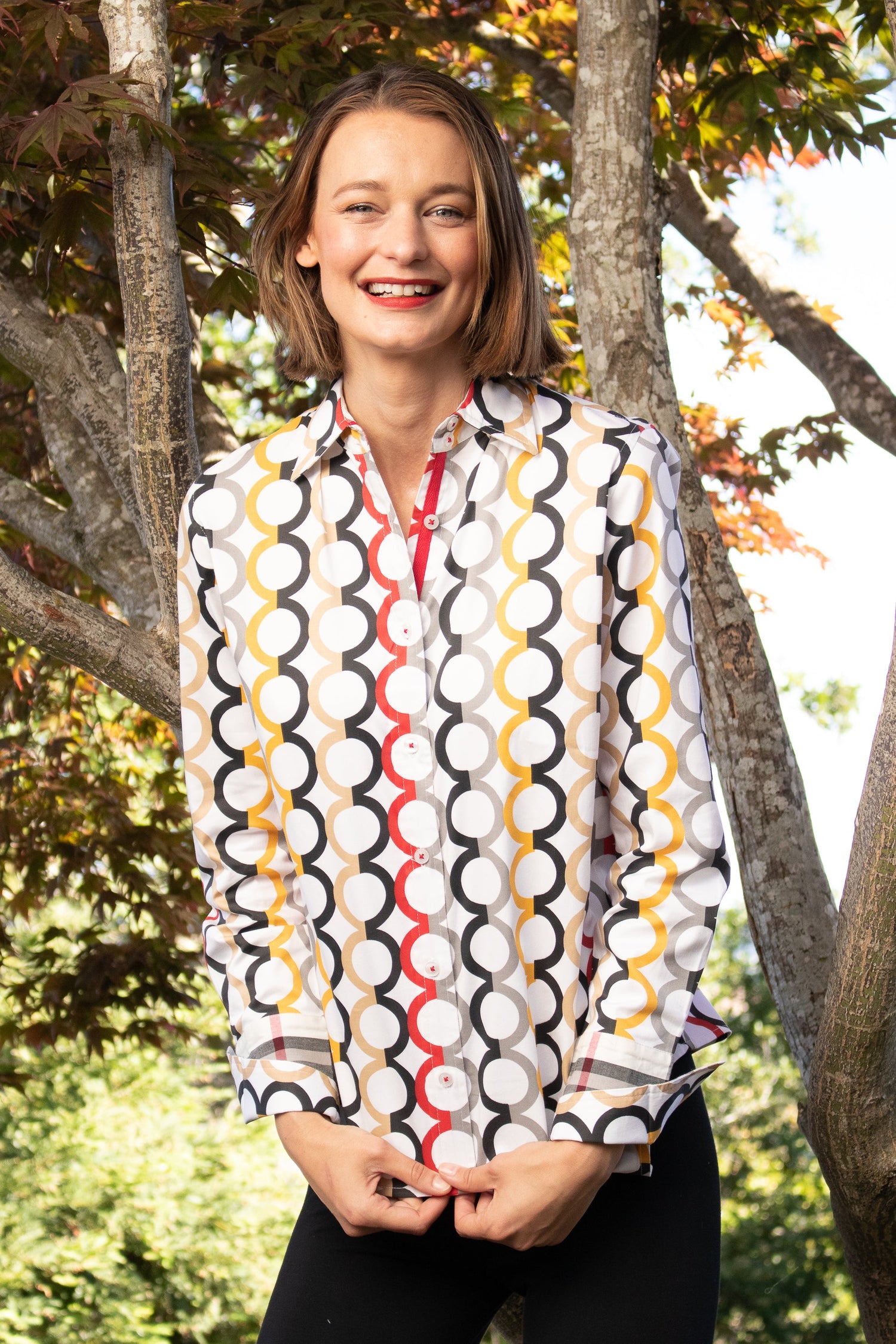 Dizzy-Lizzie Rome Shirt in fall colors with Olympic ring print, featuring a stylish and vibrant casual shirt design.