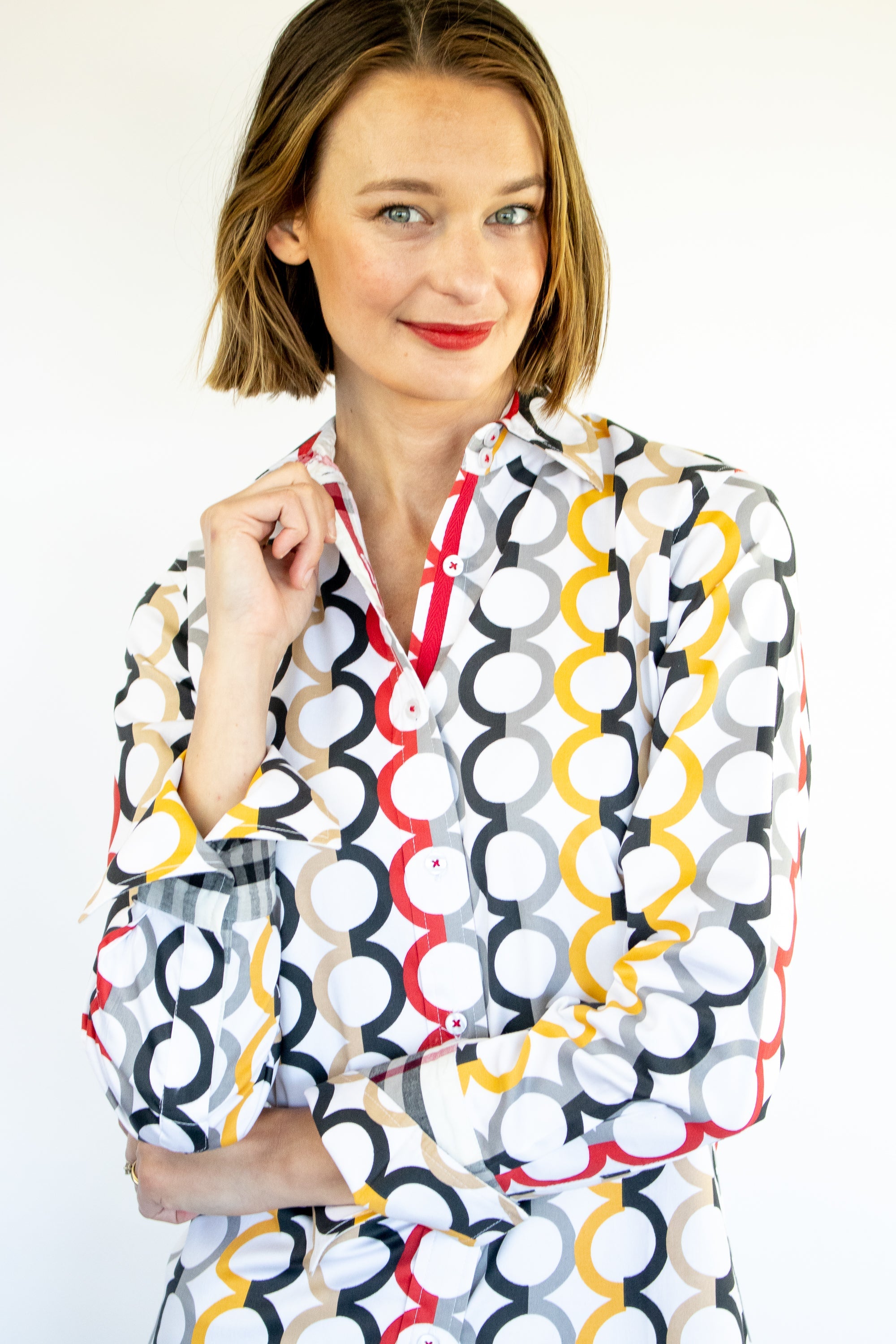 Dizzy-Lizzie Rome shirt with fall colors and Olympic ring print, featuring a stylish men&