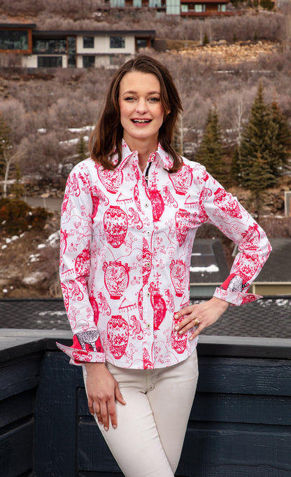 Pink and white Rome shirt by Dizzy-Lizzie featuring a stylish chin detail, displayed on a hanger against a neutral background.