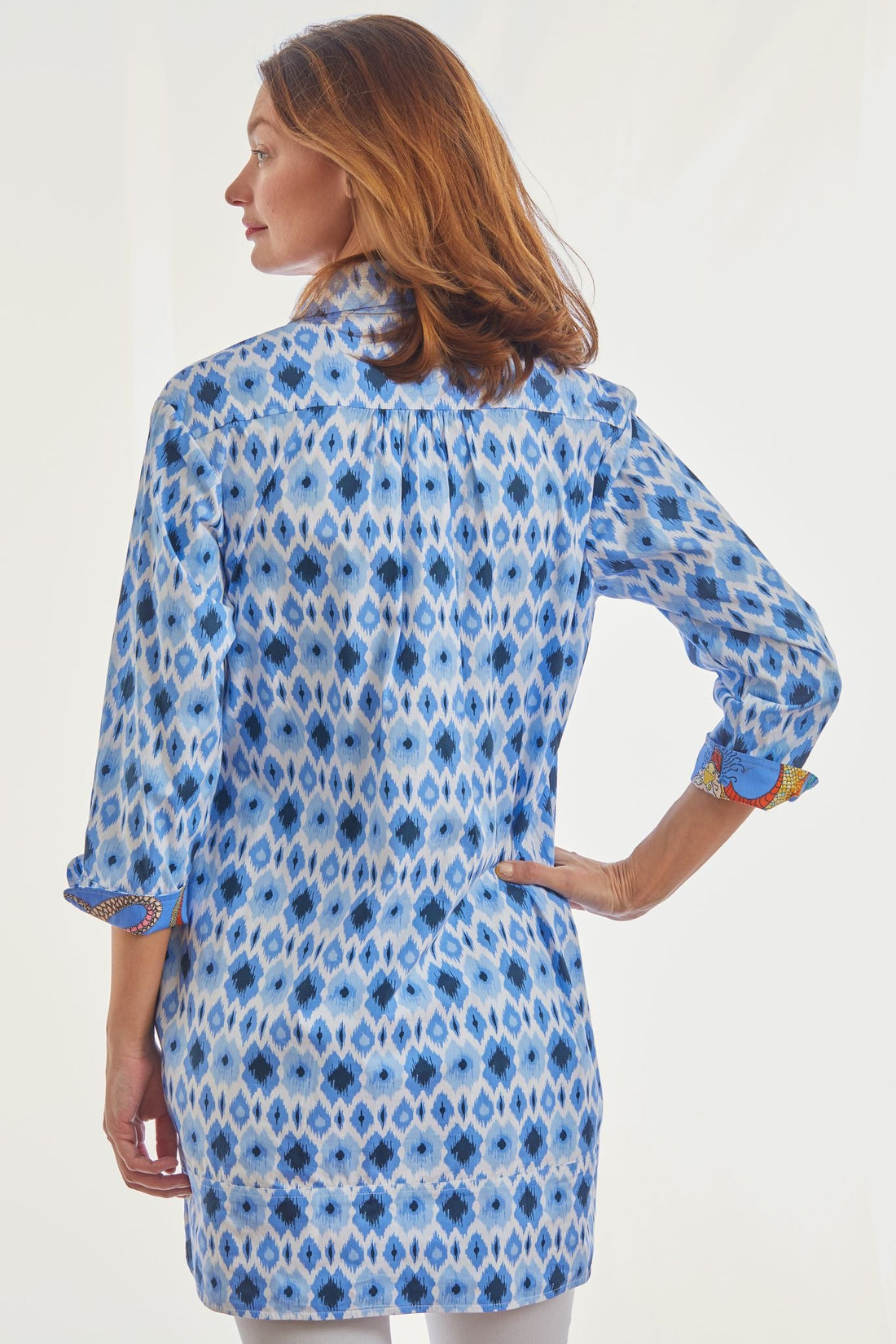 Blue Ikat print Vail Tunic shirt by Dizzy-Lizzie, featuring a relaxed fit and stylish design, shown on a white background.