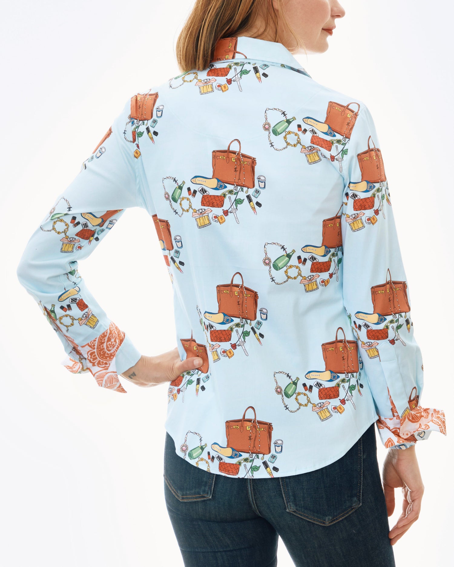 Dizzy-Lizzie Rome shirt paired with Perrier and Kelly bags, featuring stylish design and vibrant colors in a casual outfit.