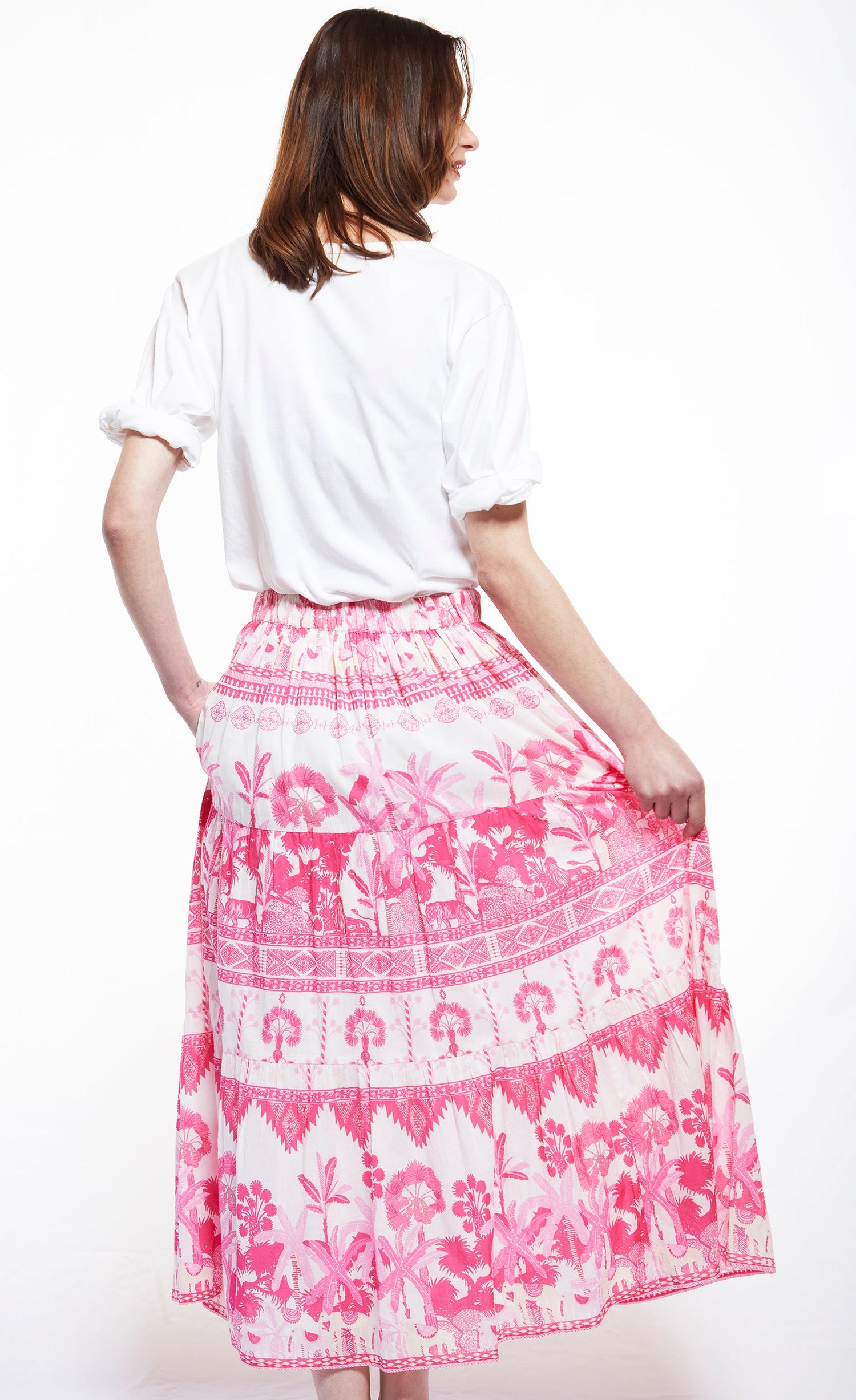 Dizzy-Lizzie Woodstock skirt with pink ikat print, flowing fabric and waist tie, perfect for casual and boho-inspired outfits.