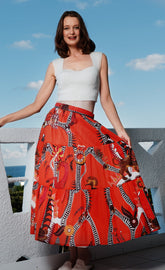 Orange abstract skirt by Dizzy-Lizzie featuring a flowing design and vibrant color, displayed on a neutral background.