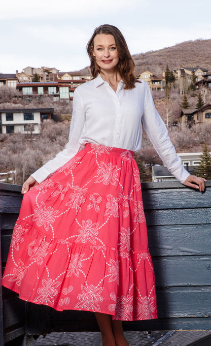 Pink and white printed Woodstock skirt by Dizzy-Lizzie, flowing and stylish with a vibrant floral pattern.