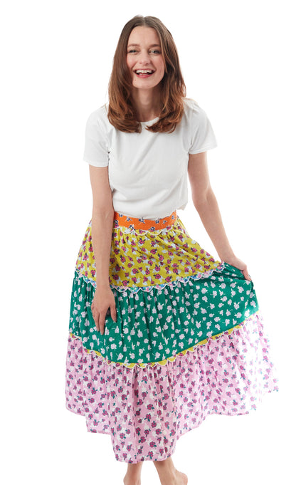 Dizzy-Lizzie Woodstock skirt with intricate embroidery, featuring a flowy design and vibrant floral patterns.