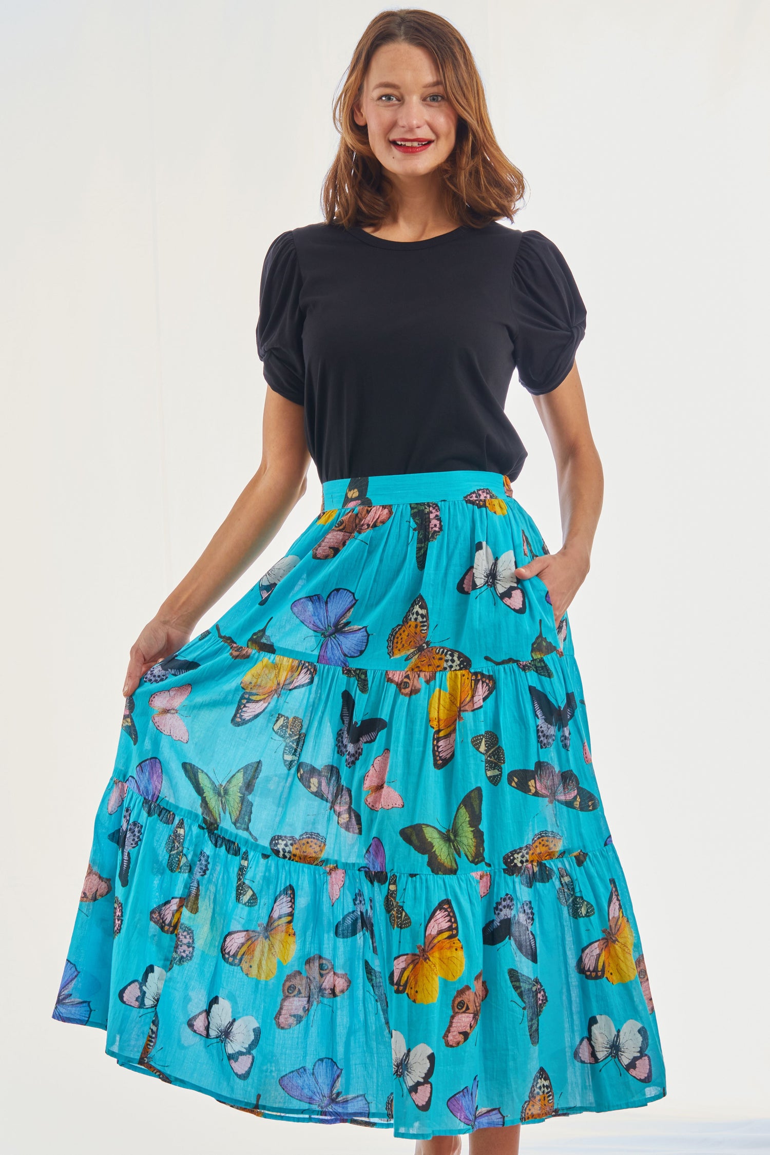 Woodstock turquoise butterfly print pull-on flounce skirt by Dizzy-Lizzie, featuring a flowy design and elastic waistband.