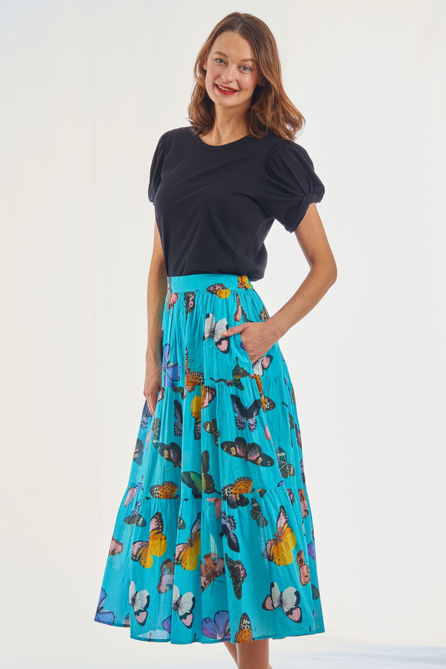 Woodstock turquoise butterfly pull-on flounce skirt by Dizzy-Lizzie with a flowy, ruffled design and butterfly motif.
