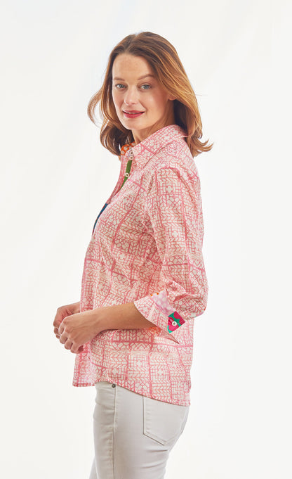Pink 3/4 sleeve geometric print voile top by Dizzy-Lizzie with tiny pattern and relaxed fit, shown on a hanger.