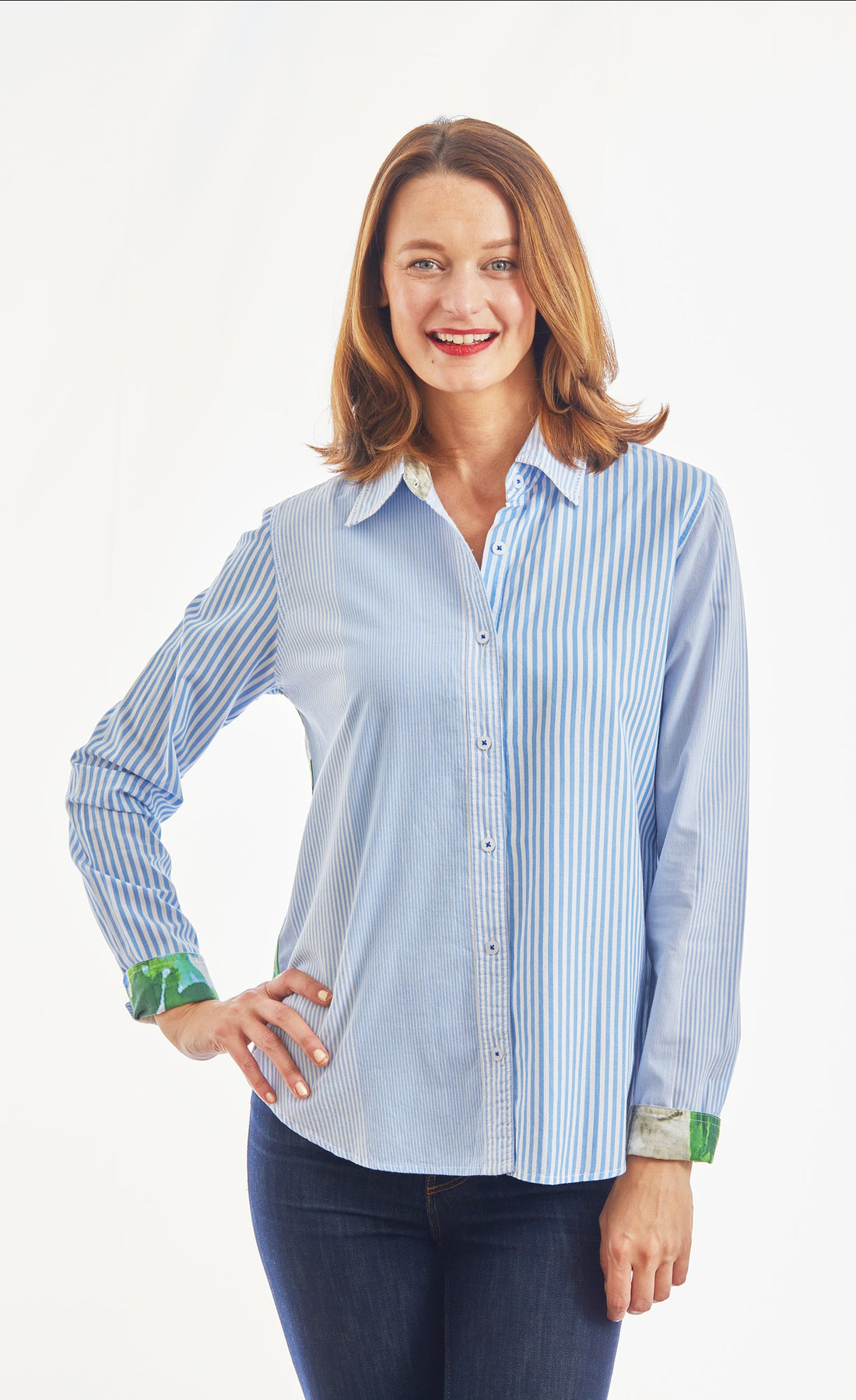 Dizzy-Lizzie Chesapeake top in blue and white stripe with floral motif on back, featuring picket fence and hydrangea design.
