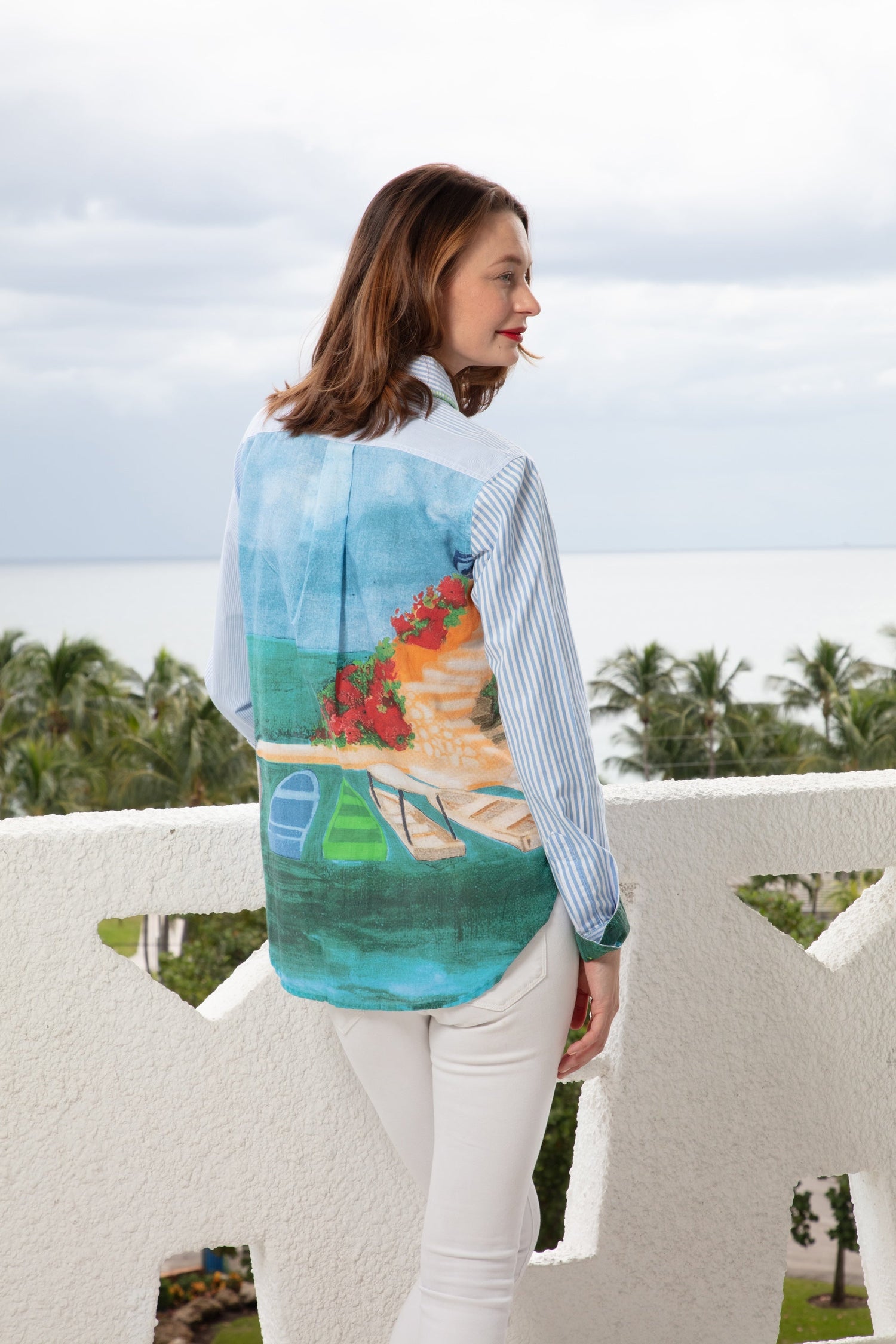 Dizzy-Lizzie Chesapeake Top in blue and white stripes with a Positano scene on the back, casual stylish women’s top.