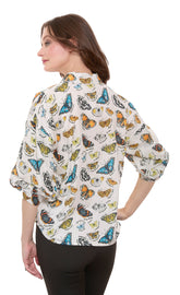 Dizzy-Lizzie Milano puff sleeve top with butterfly print on ivory cotton voile fabric, stylish and lightweight for warm weather.