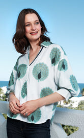 Dizzy-Lizzie Milano puff sleeve top with peacock print in cotton voile, featuring ivory and soft green colors.