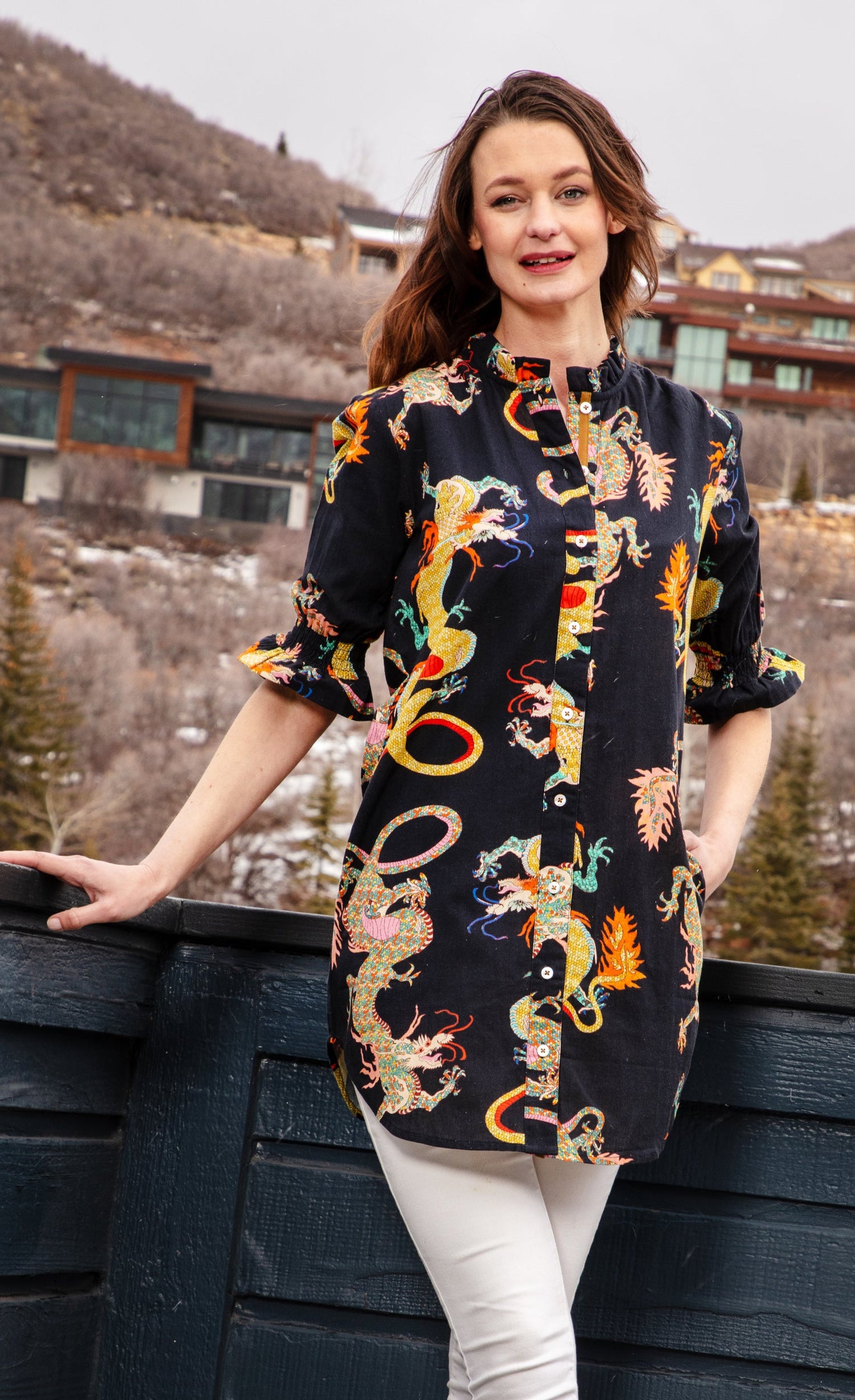 Black ruffle tunic with a dragon design from Dizzy-Lizzie, featuring a loose fit and trendy style, shown on a model.