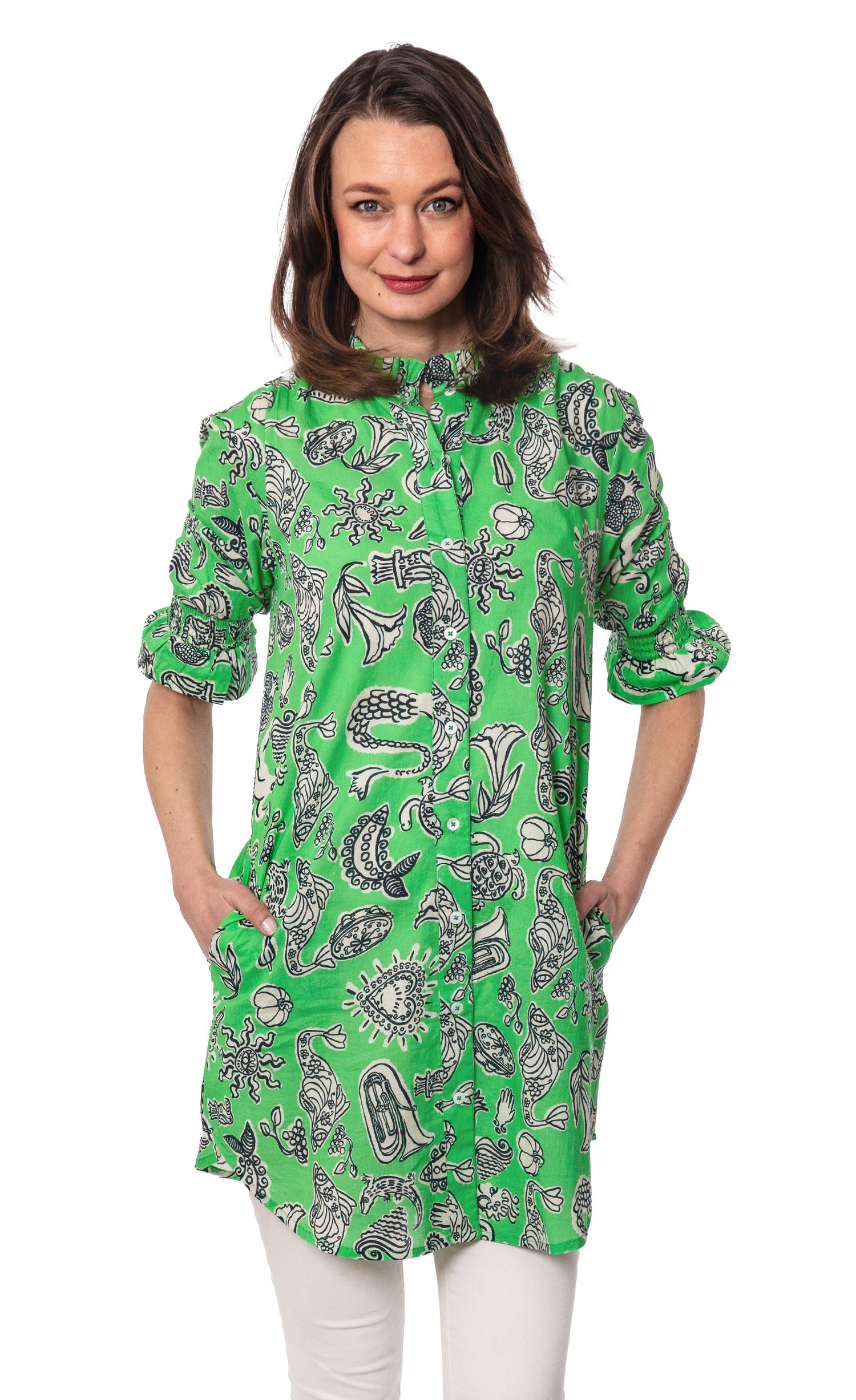 Green ruffle tunic with whimsical print by Dizzy-Lizzie, featuring a loose fit and stylish design for casual wear.